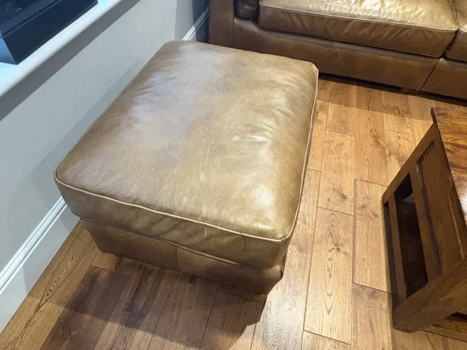 Leather sofas and footstool - furniture village