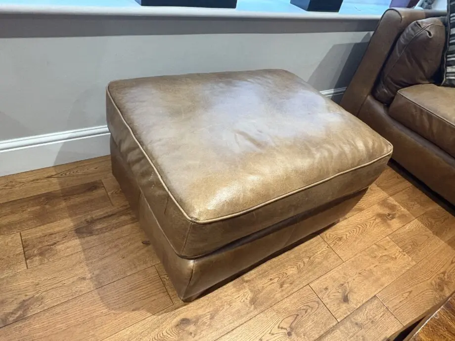 Leather sofas and footstool - furniture village