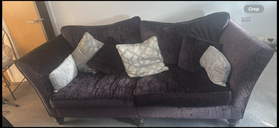 Maroon velvet three seater sofa