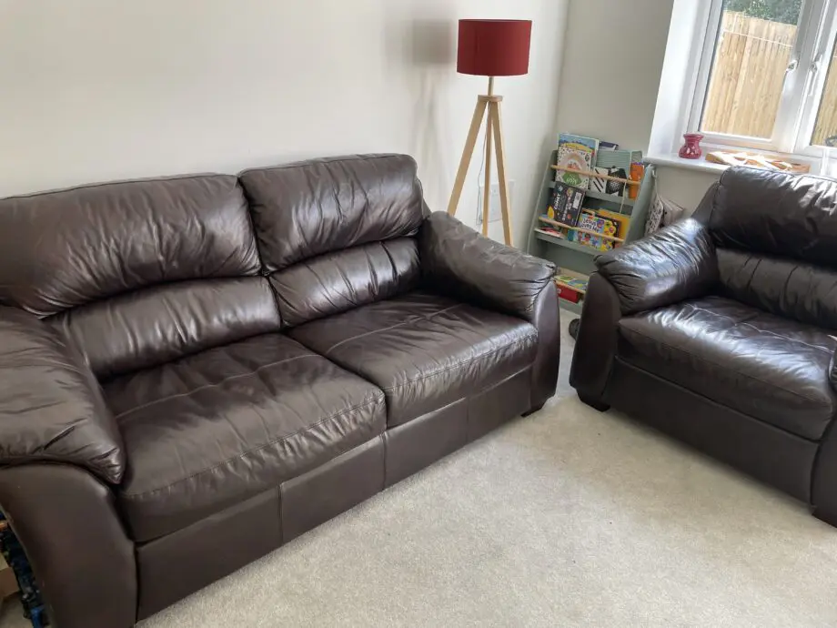 Dark brown leather sofa set of a 2/3 seater and matching chair
