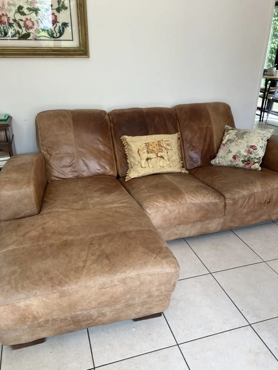 L shaped tan leather sofa