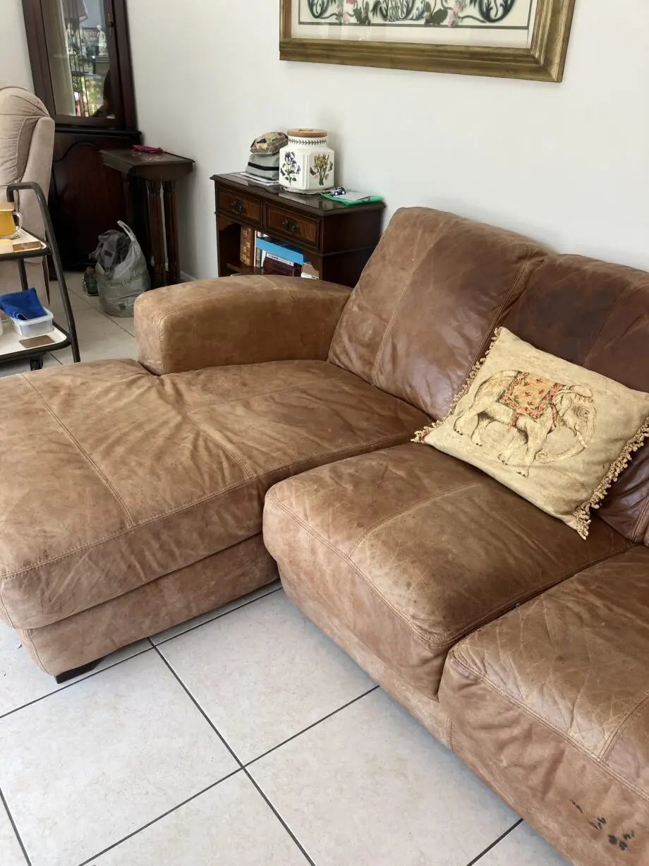 L shaped tan leather sofa
