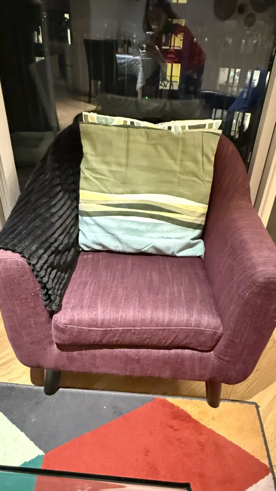David Phillips black double seater sofa and purple corner sofa