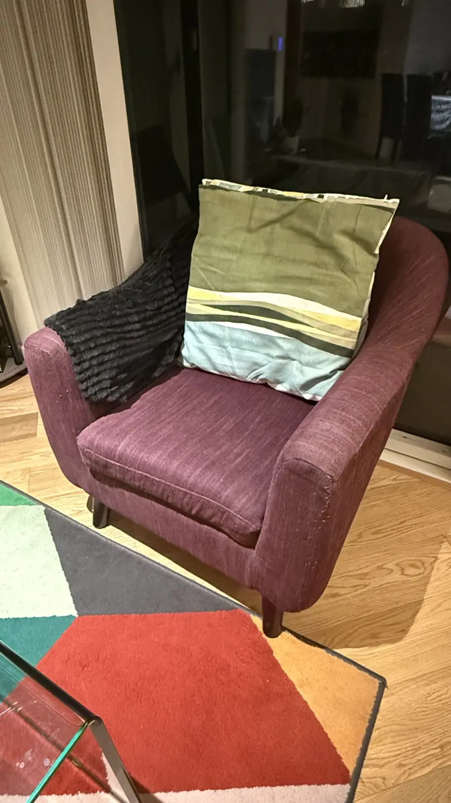 David Phillips black double seater sofa and purple corner sofa