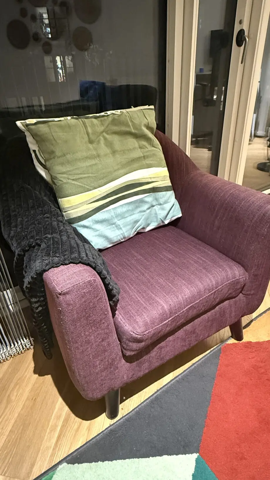 David Phillips black double seater sofa and purple corner sofa