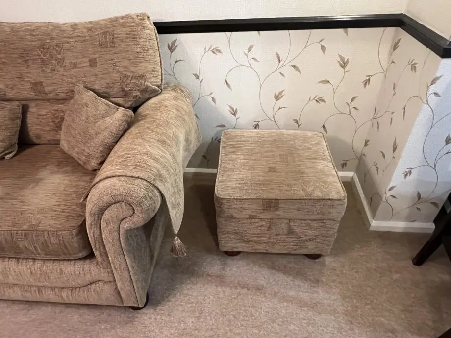 Quality made Three seater sofa with 3 matching scatter cushions and opening storage pouffe in beige brown.