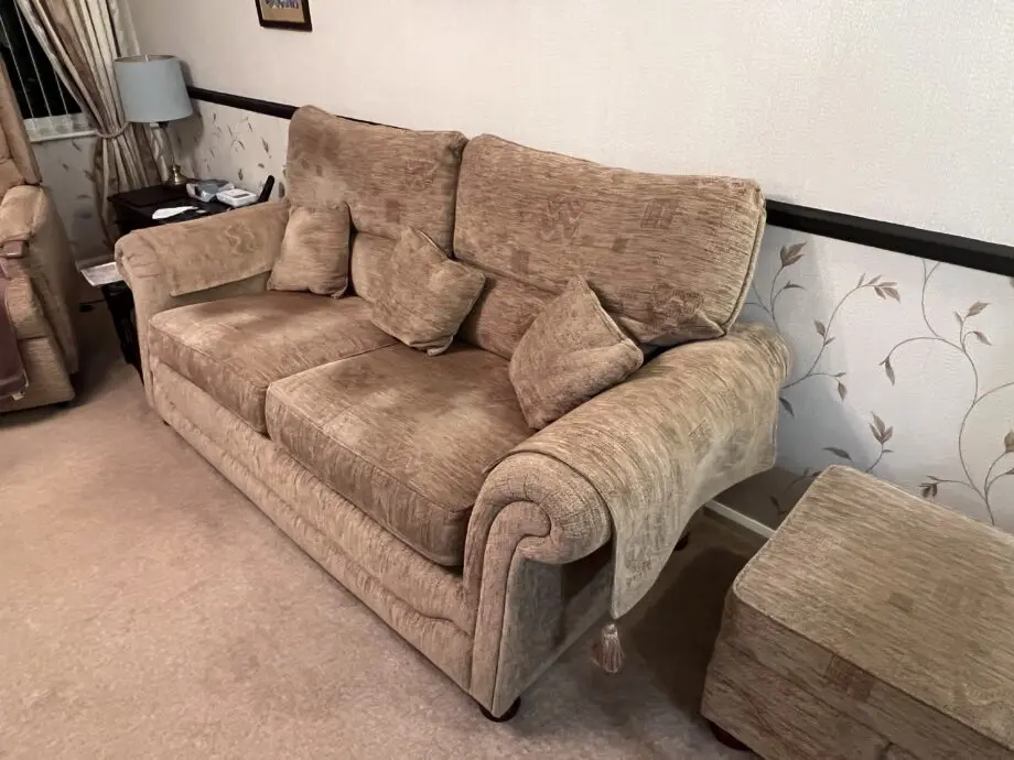 Quality made Three seater sofa with 3 matching scatter cushions and opening storage pouffe in beige brown.
