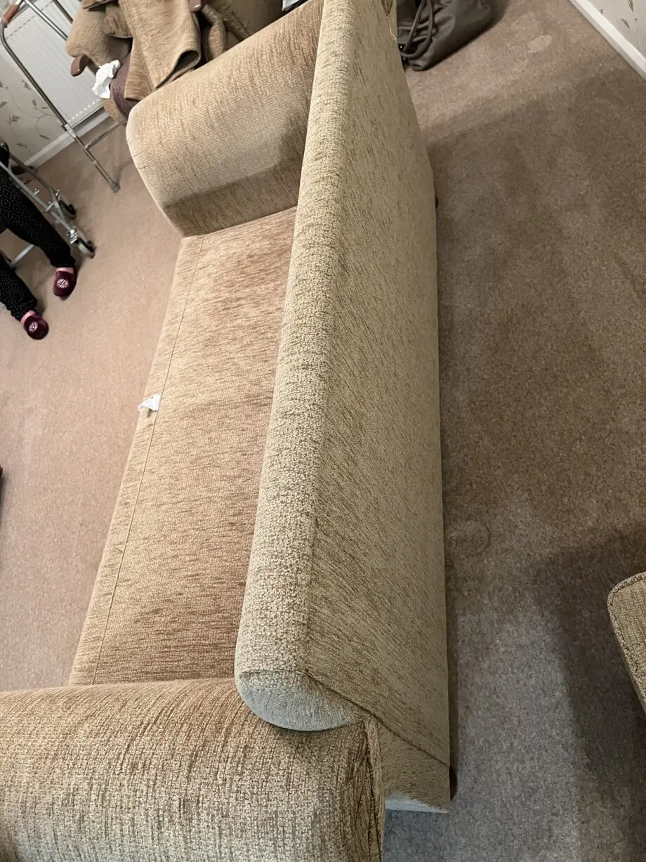 Quality made Three seater sofa with 3 matching scatter cushions and opening storage pouffe in beige brown.
