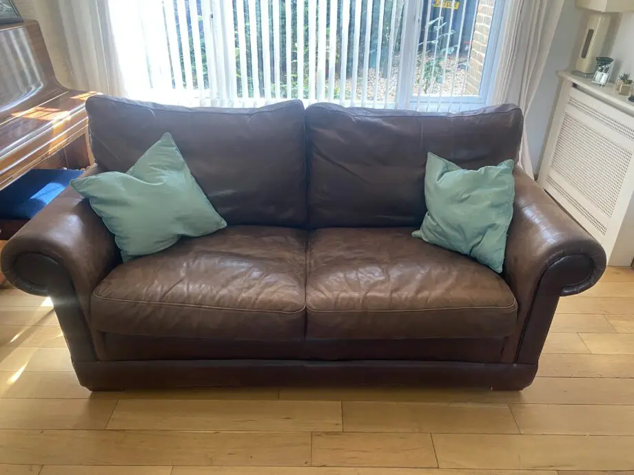 2 x two seater brown leather sofas from John Lewis
