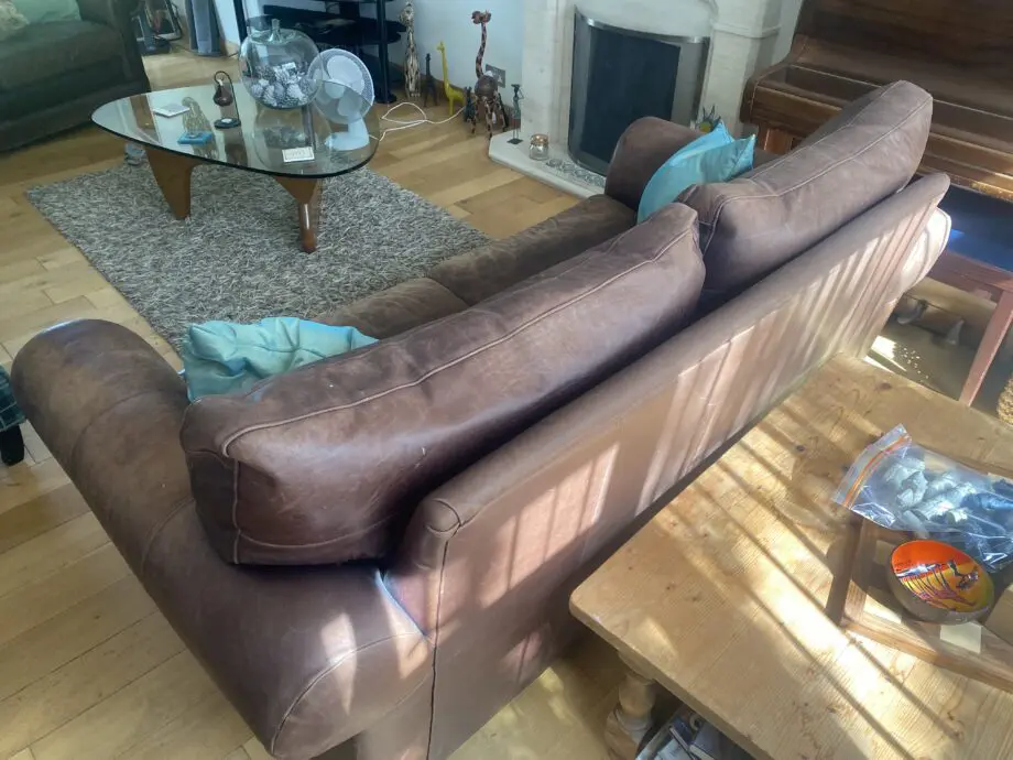 2 x two seater brown leather sofas from John Lewis