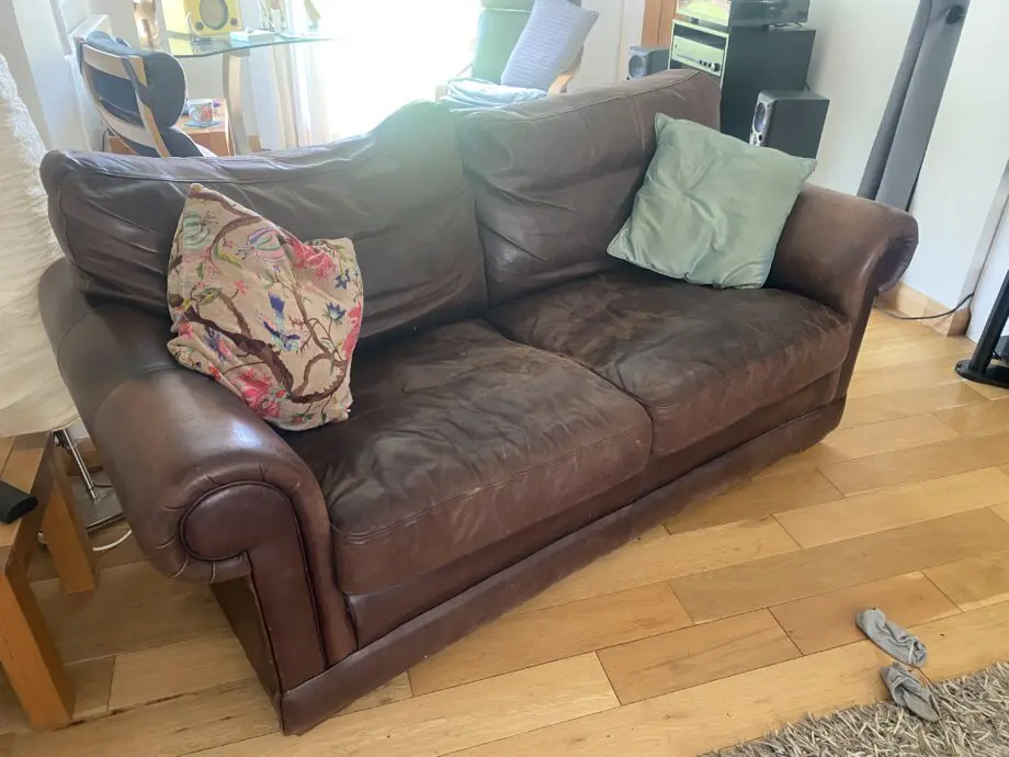 2 x two seater brown leather sofas from John Lewis