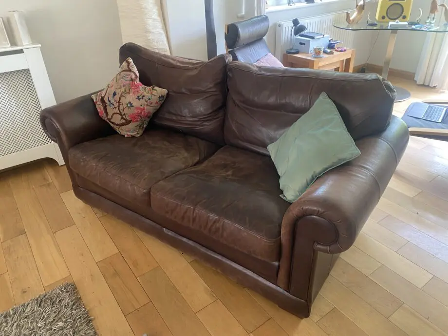 2 x two seater brown leather sofas from John Lewis