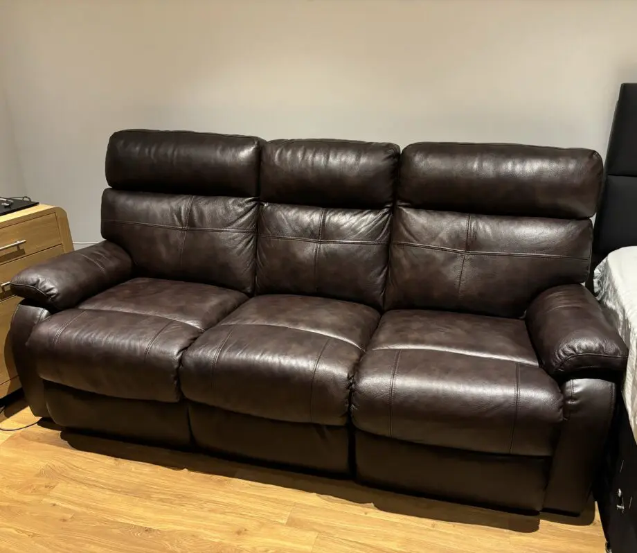 DFS dark brown leather 3 seater manual recliner