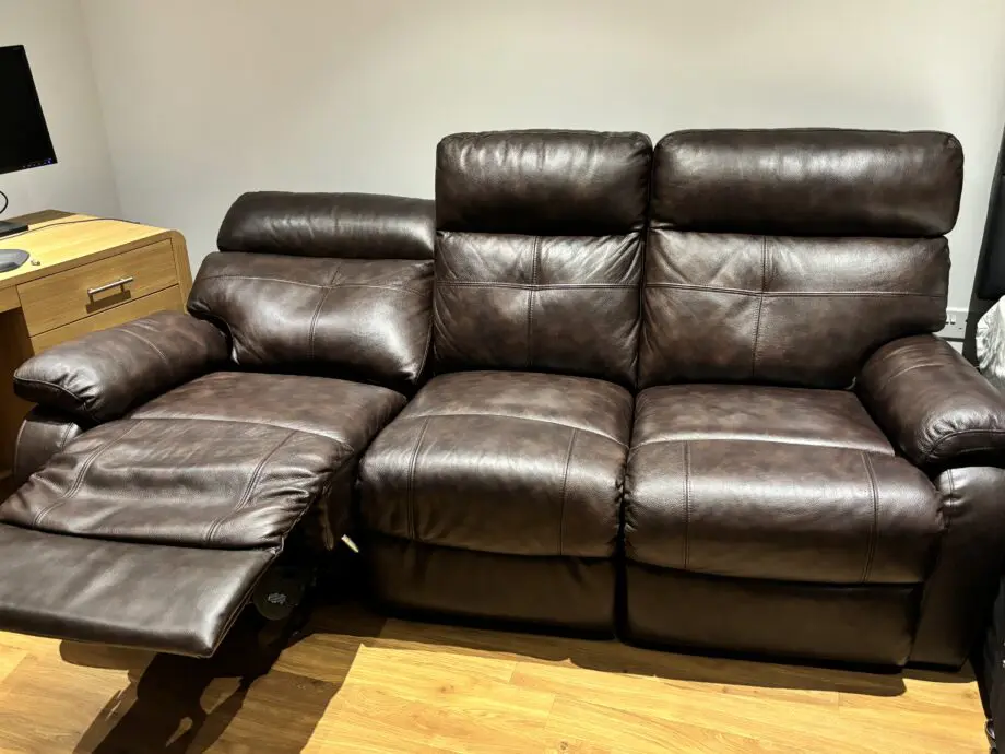 DFS dark brown leather 3 seater manual recliner