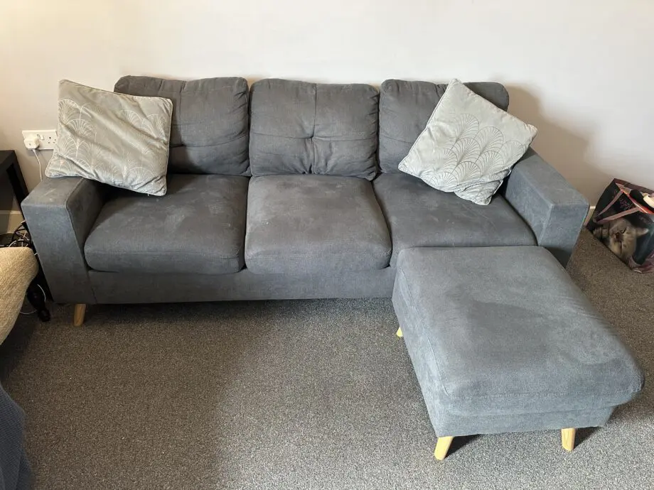 Grey 3 seater sofa from The Range with footstool
