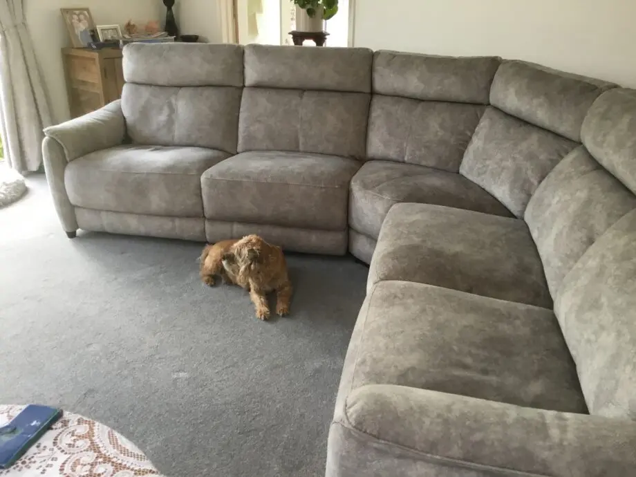 Light silvery grey curved corner sofa, large, from Peter green . Name of sofa is Bentley