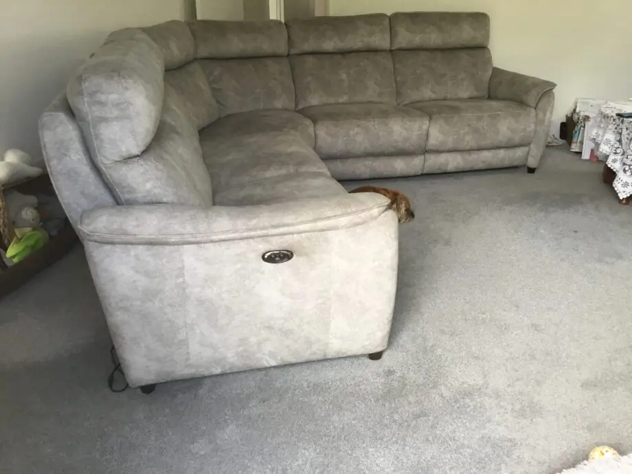 Light silvery grey curved corner sofa, large, from Peter green . Name of sofa is Bentley
