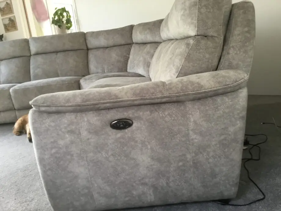 Light silvery grey curved corner sofa, large, from Peter green . Name of sofa is Bentley
