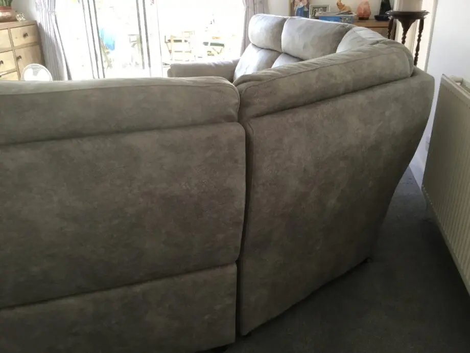 Light silvery grey curved corner sofa, large, from Peter green . Name of sofa is Bentley