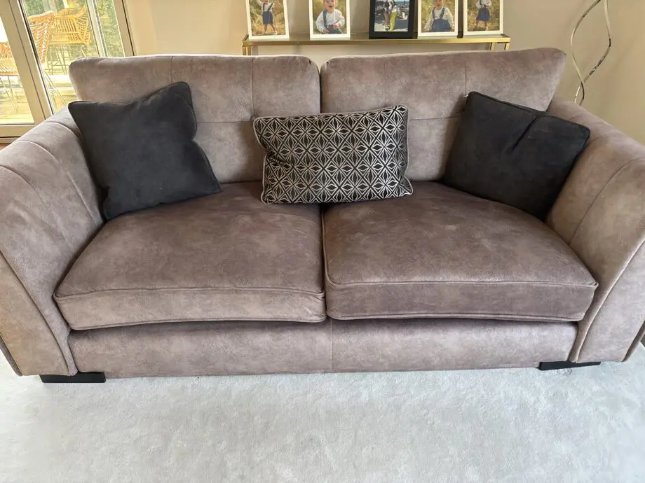 2 immaculate 3 seater sofas, complete with 3 cushions on each sofa. Very clean, golden colour studs, black feet
