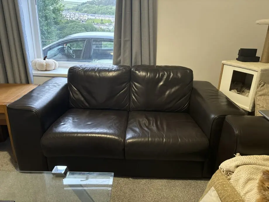 Maskreys Dark brown leather two seater sofa