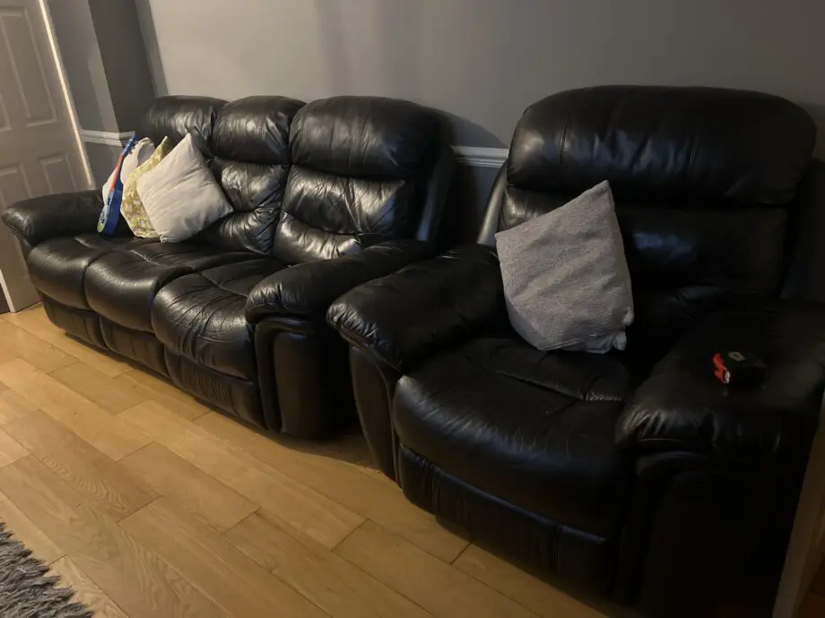 Electric black leather reclining sofas - Italian leather