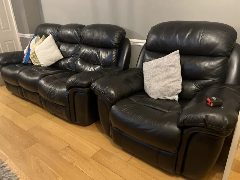 Electric black leather reclining sofas - Italian leather