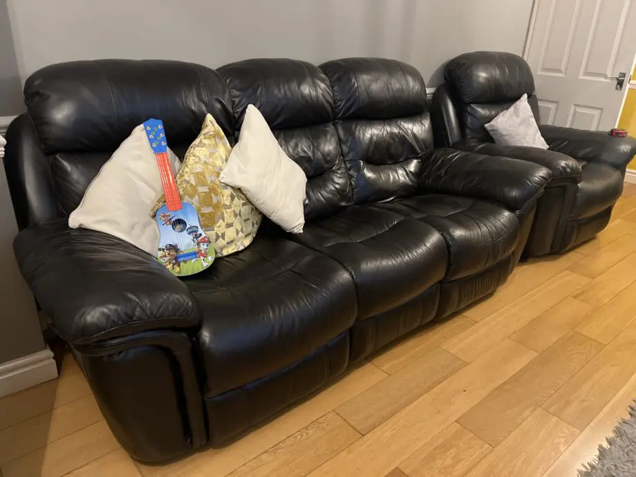 Electric black leather reclining sofas - Italian leather