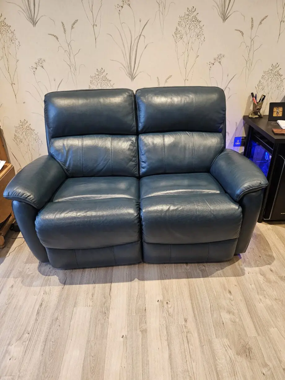 Teal leather 2 seater recliner sofa by DFS