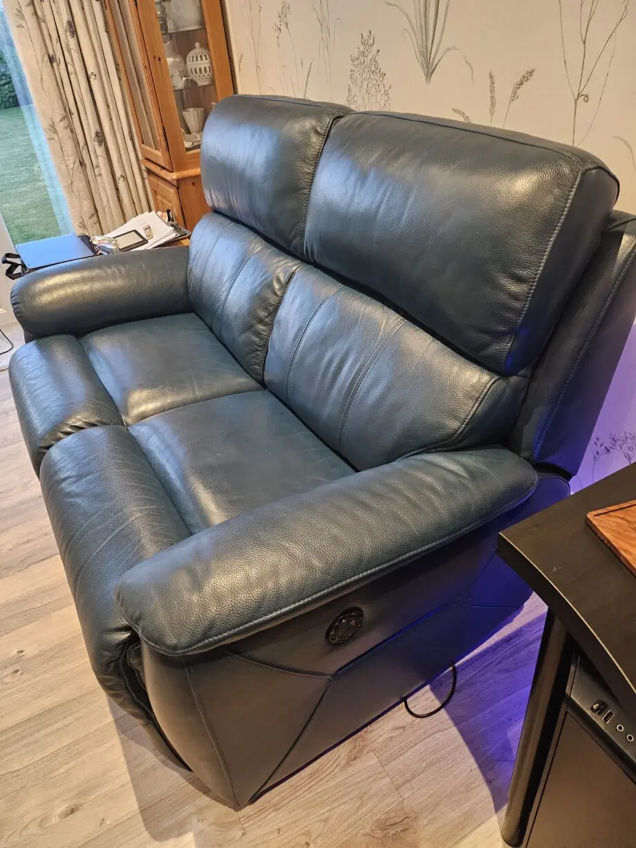 Teal leather 2 seater recliner sofa by DFS