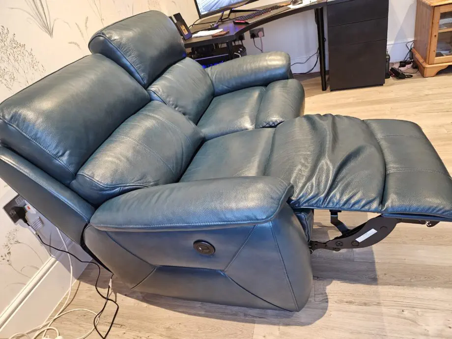 Teal leather 2 seater recliner sofa by DFS