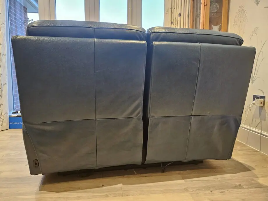 Teal leather 2 seater recliner sofa by DFS