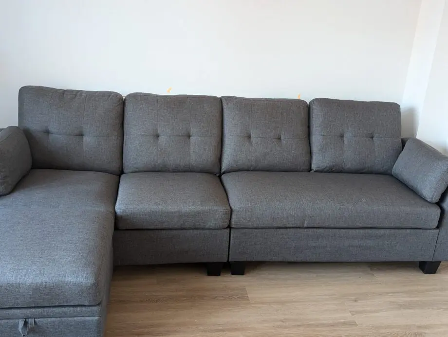 Grey 4 seater sofa with a chaise