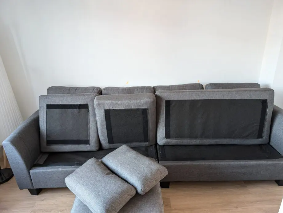 Grey 4 seater sofa with a chaise