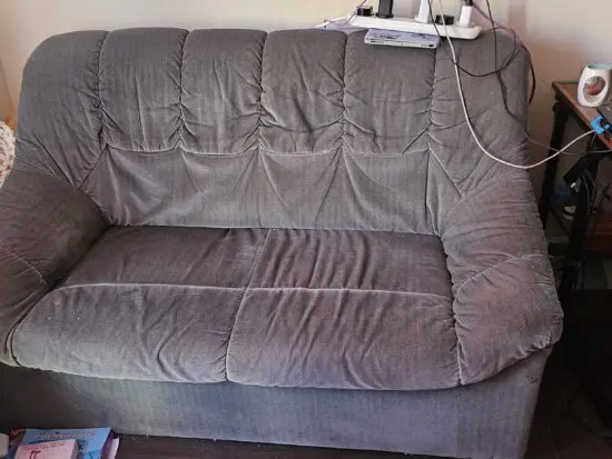 Unknown green 2 seater sofa