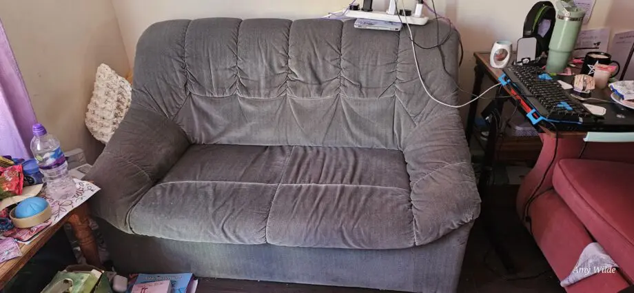 Unknown green 2 seater sofa