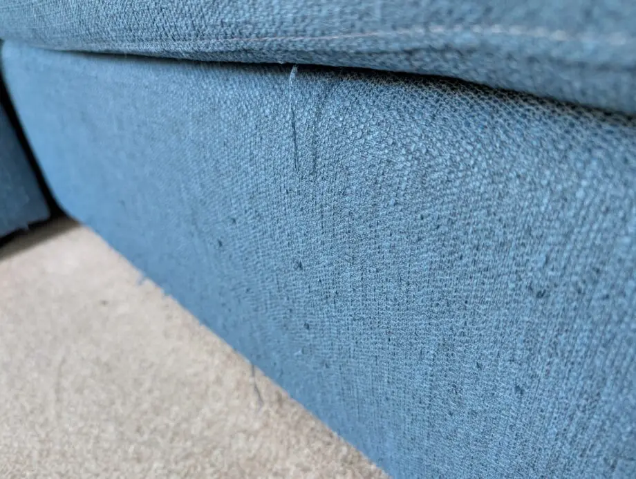 Navy blue corner sofa with scatter cushion back