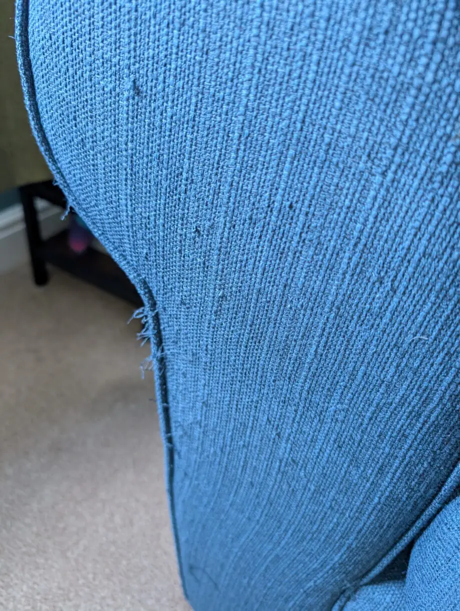 Navy blue corner sofa with scatter cushion back
