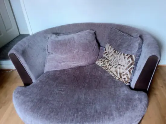 Rotating grey couch for 1 person.