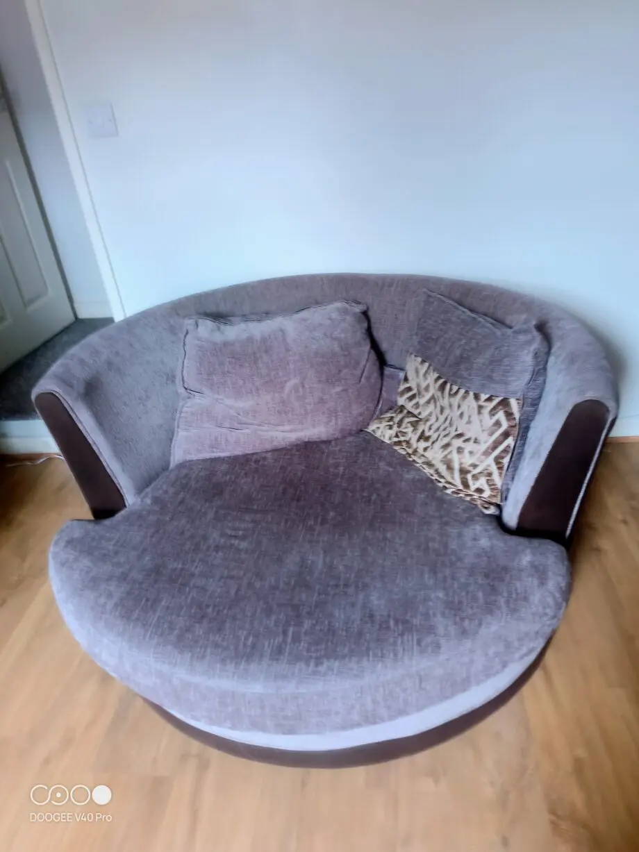 Rotating grey couch for 1 person.