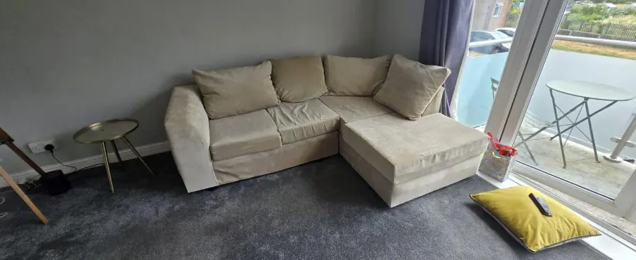 Barely used 3 seater L shape sofa in beige
