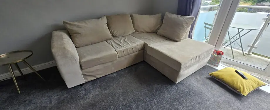 Barely used 3 seater L shape sofa in beige