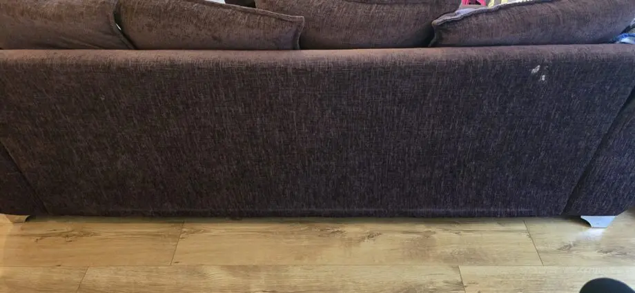 Cushion backed brown three seater sofa and brown armchair