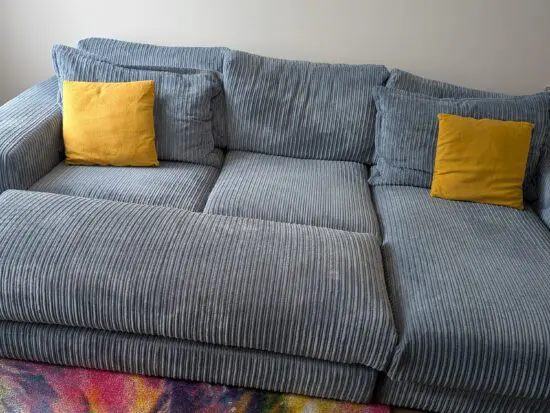 DfS right hand facing 3 seater csofa.haise sofa with large bench footstool ,in rest cord material,sky blue in color.