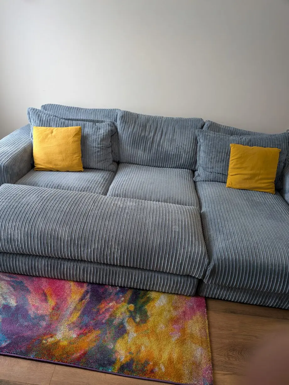 DfS right hand facing 3 seater csofa.haise sofa with large bench footstool ,in rest cord material,sky blue in color.