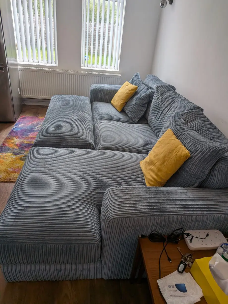 DfS right hand facing 3 seater csofa.haise sofa with large bench footstool ,in rest cord material,sky blue in color.