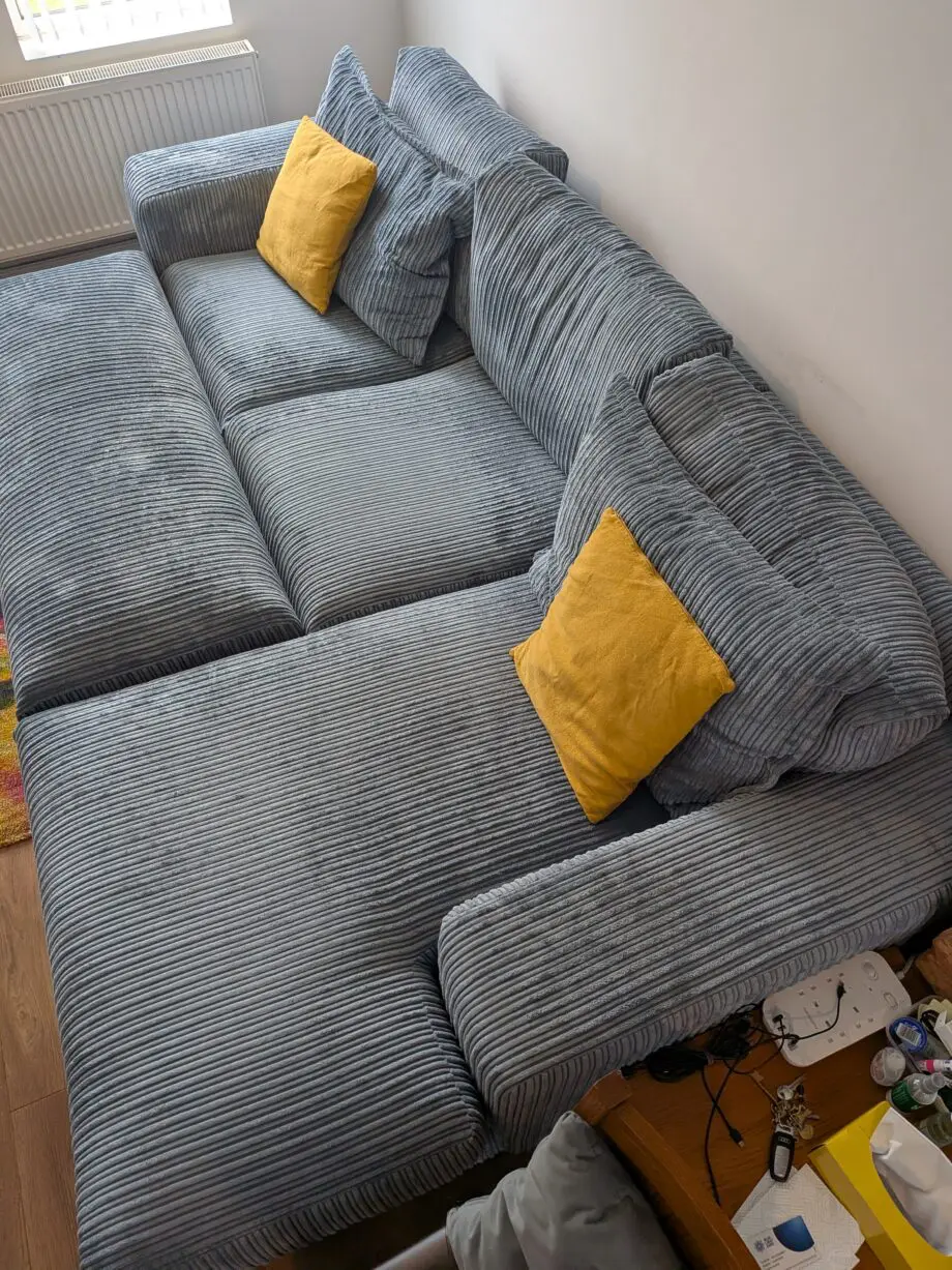 DfS right hand facing 3 seater csofa.haise sofa with large bench footstool ,in rest cord material,sky blue in color.
