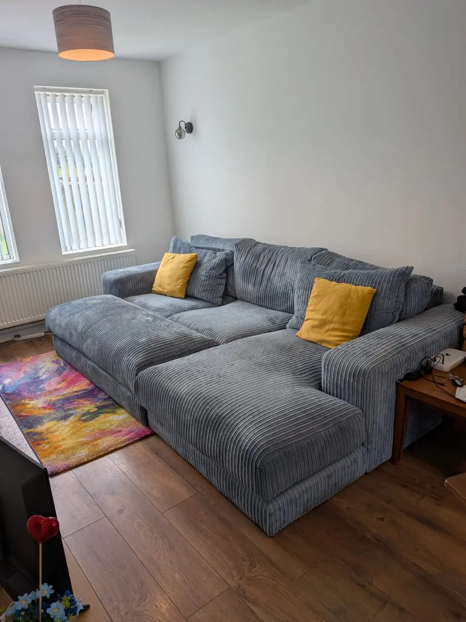 DfS right hand facing 3 seater csofa.haise sofa with large bench footstool ,in rest cord material,sky blue in color.