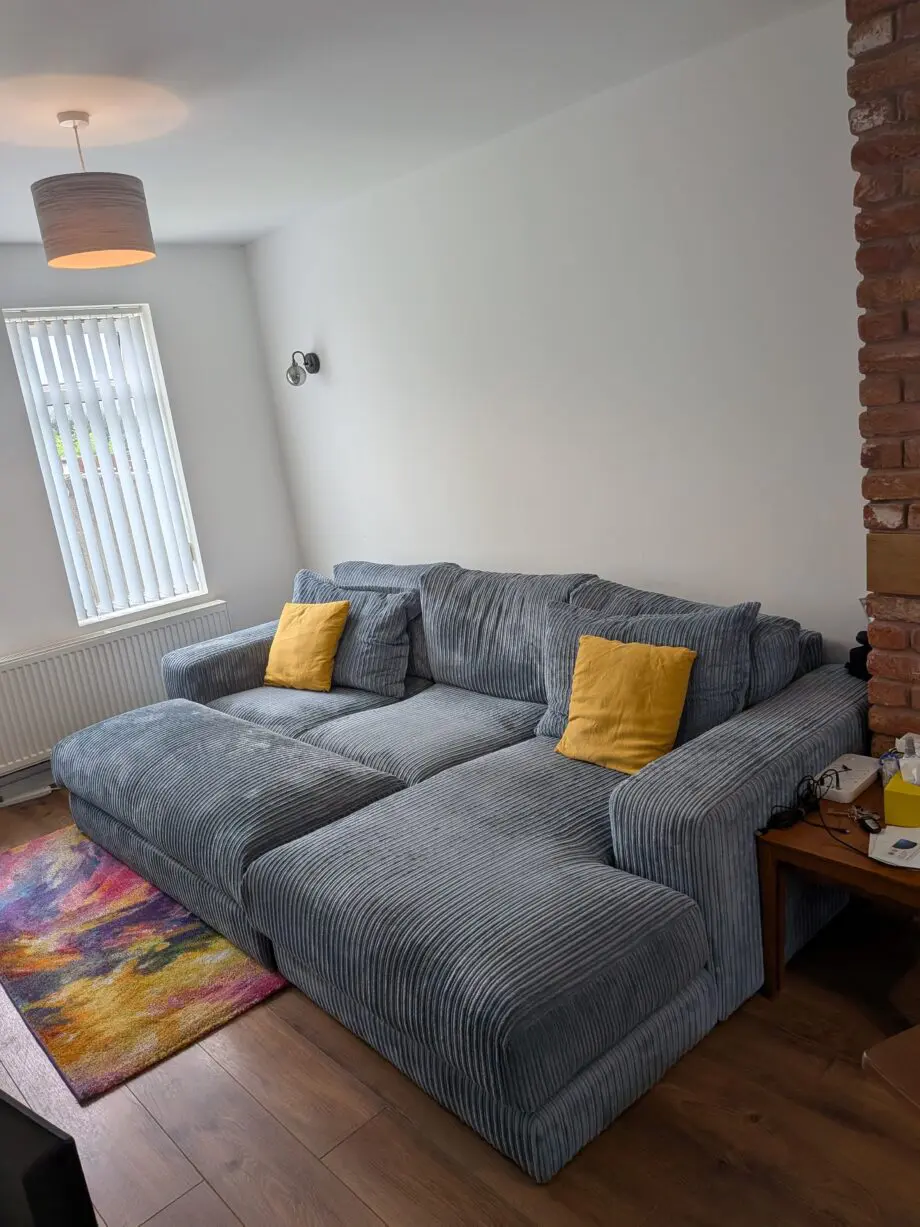 DfS right hand facing 3 seater csofa.haise sofa with large bench footstool ,in rest cord material,sky blue in color.