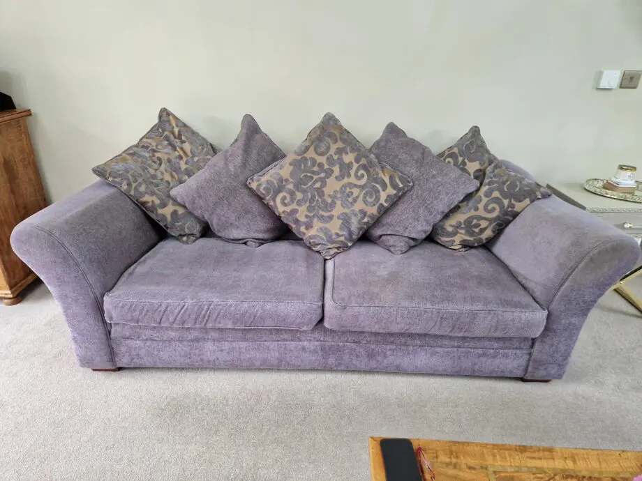 DFS Grey with Gold patterned sofa.